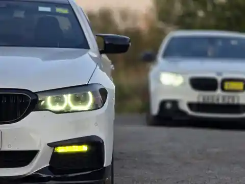Two Pro Ride BMW vehicles photographed together with one in sharp foreground focus